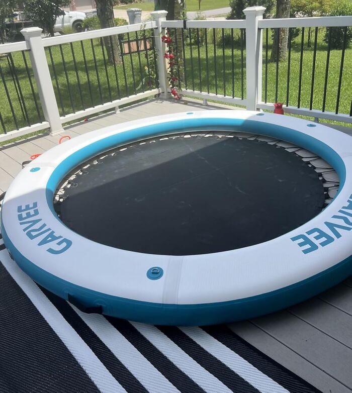 Inflatable round trampoline on a deck with white railing, showcasing one of the weirdest picks found on Amazon.