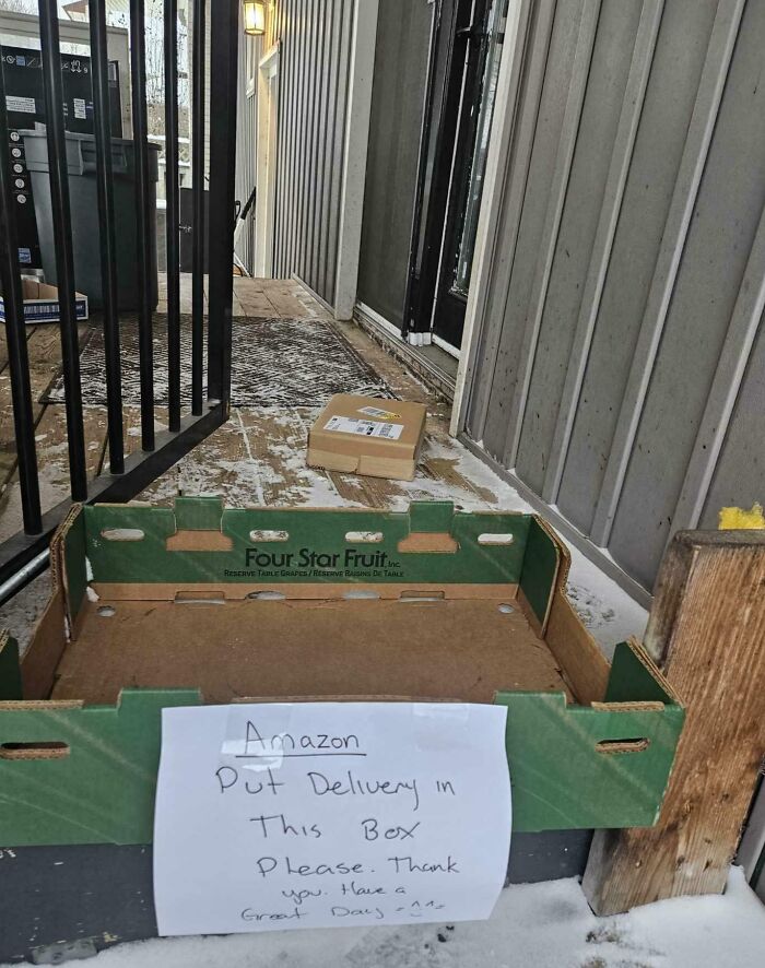 Cardboard box on porch with handwritten note asking for deliveries in box, highlighting package delivery issues off track.