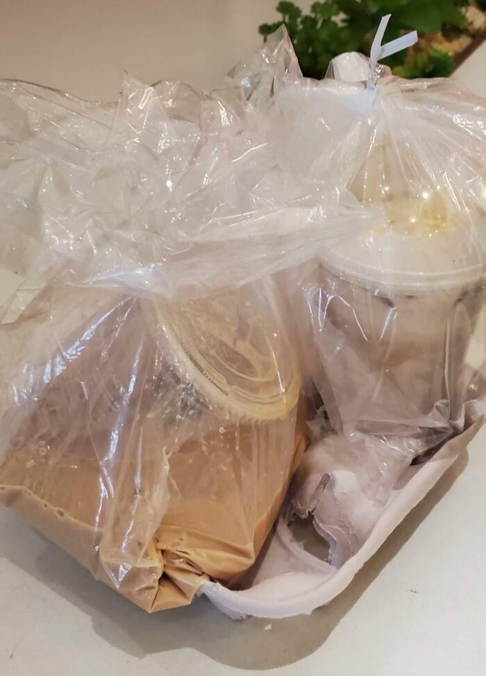 Plastic bags with spilled drinks, showing a package delivery fail where liquid leaked inside the container.