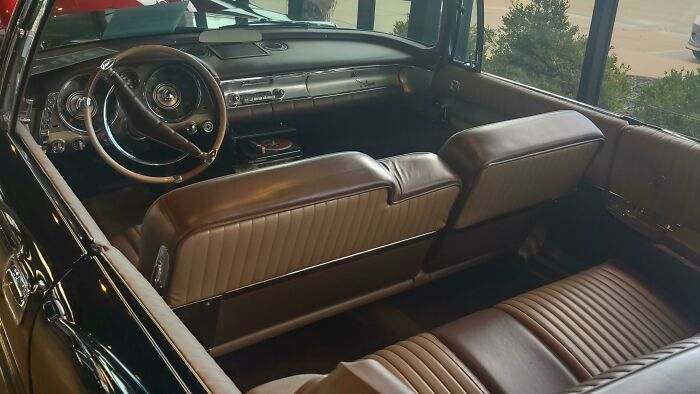 Vintage 1950s car interior with leather seats and classic dashboard, capturing the essence of life in the 1950s.