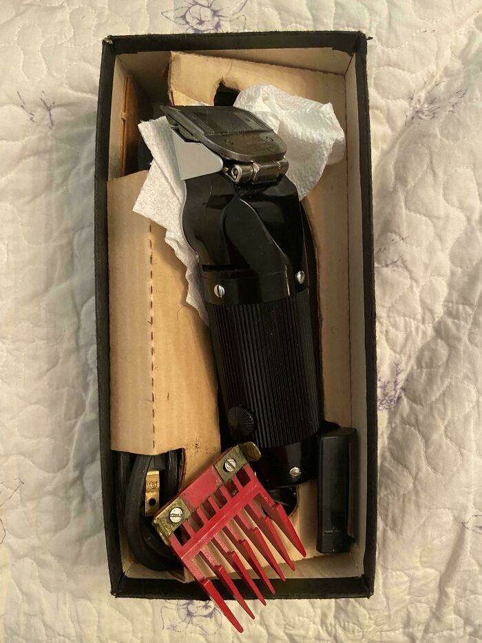 Vintage electric hair clipper in original box, showcasing classic 1950s design and technology from the mid-20th century.