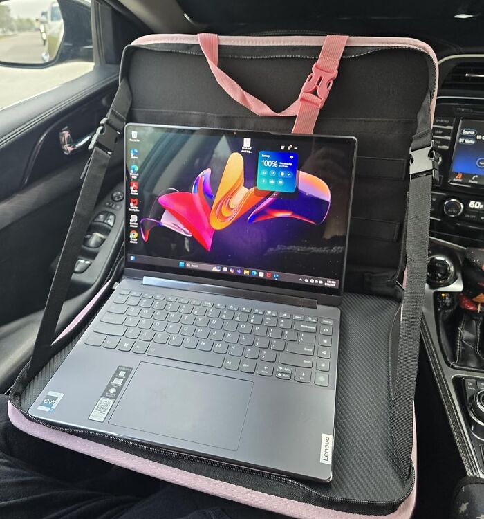 Car accessories for organizing the passenger seat, featuring a laptop holder and storage unit inside a vehicle.