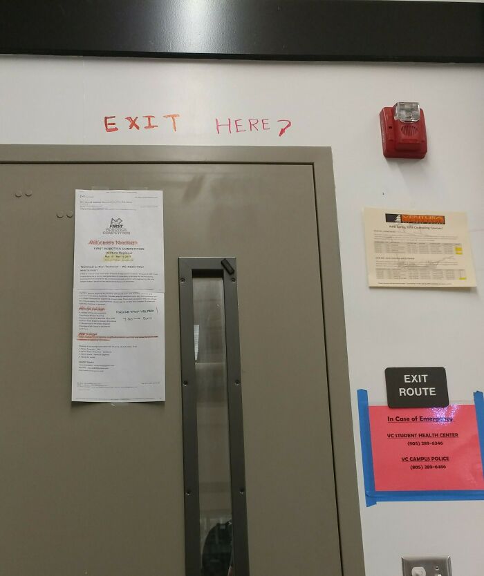 Exit door in a school hallway with handwritten sign questioning the exit, illustrating schools not created equal or great.