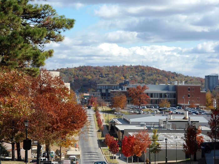Autumn cityscape with colorful trees, buildings, and hills in one of the best places to live in the USA.