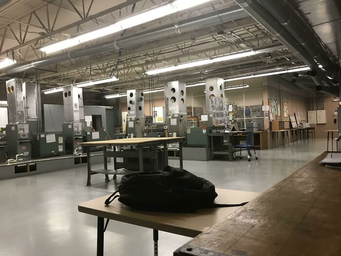 Industrial classroom with outdated equipment and a backpack on the table showing schools are not all created equal or great