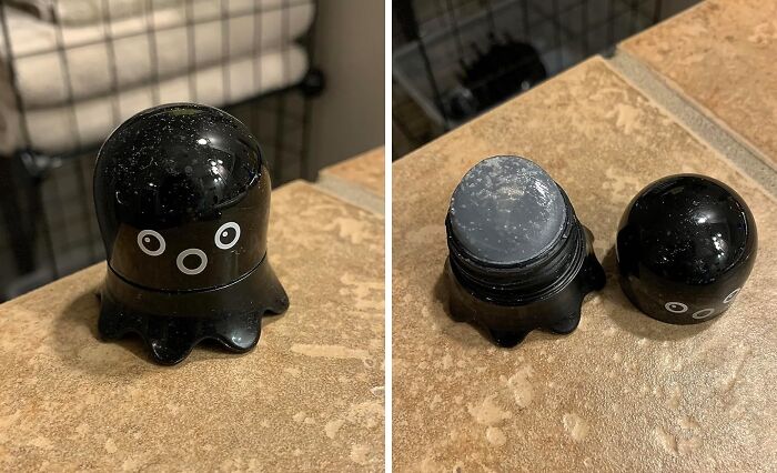 Black octopus-shaped quirky find with eyes, shown closed and opened on a beige tiled surface.