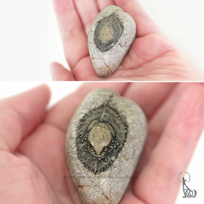 Close-up of a stone painted by a Japanese artist to resemble an adorable animal, held in an open palm.