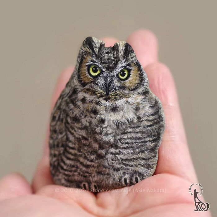 Hand-painted stone resembling an owl, showcasing Japanese artist’s skill in turning stones into adorable animals.