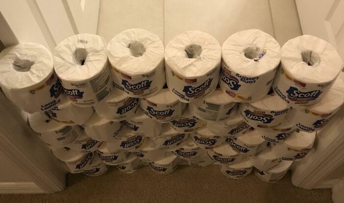 Toilet paper rolls stacked and balanced in a doorway as a hilarious dad prank showcasing creative fatherhood humor.