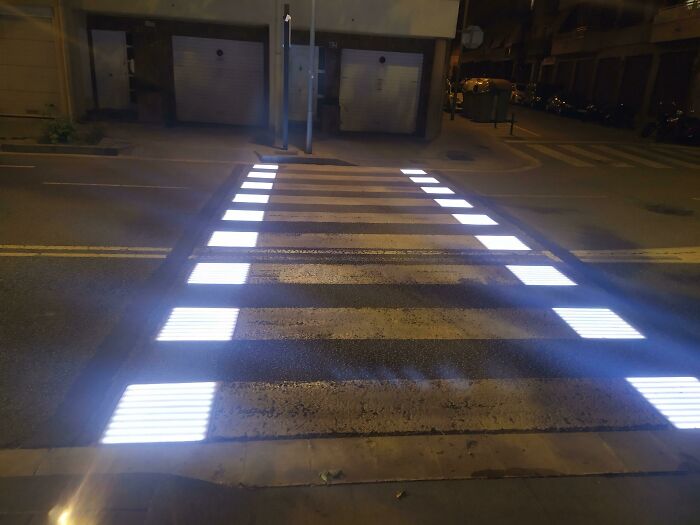 Illuminated pedestrian crosswalk with LED lights enhancing visibility as a genius solution to common safety problems.