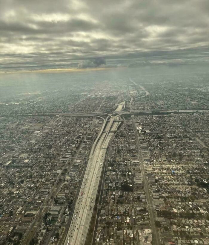 Aerial view of a vast urban area with highways and dense city layout showcasing world geography features.
