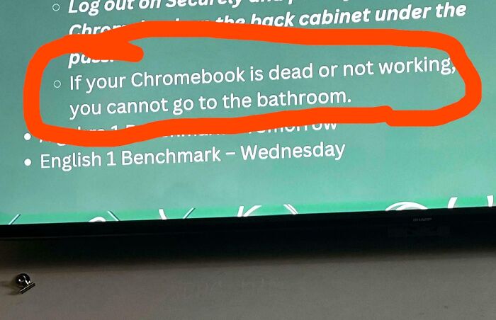 Classroom rule displayed on screen about Chromebook issues and bathroom use, highlighting schools are not all created equal.