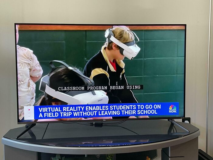 Students using virtual reality headsets in a classroom, demonstrating innovative school learning technology.