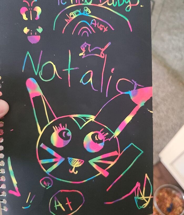 Colorful scratch art of a cat with name Natalia, showcasing creativity for toys under $20 gift ideas.