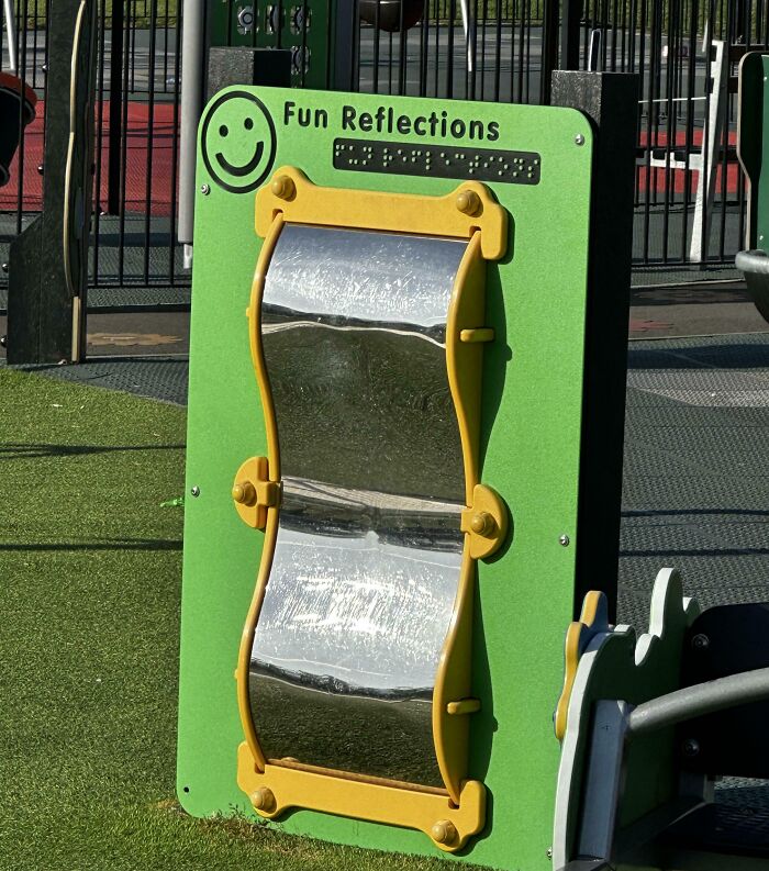 Curved funhouse mirror playground panel reflecting distorted images, showcasing creative genius solutions for overlooked problems.