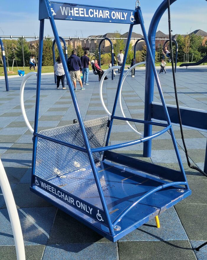 Accessible wheelchair swing at a playground offering a genius solution for inclusive outdoor play and mobility challenges.