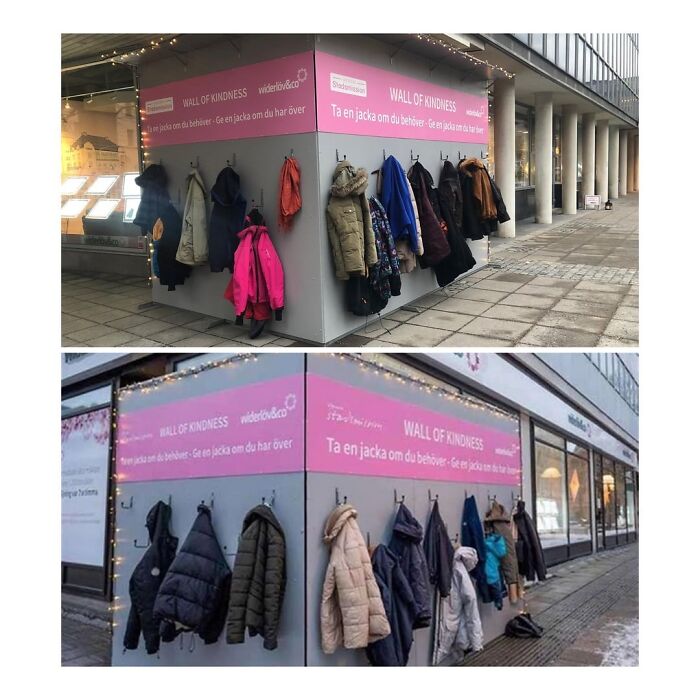 Wall of kindness with coats hanging outside a building, showcasing community care and beauty of planet Earth.