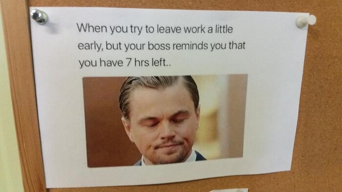 Printed meme pinned on a corkboard showing a man frustrated, highlighting the humor in workplace struggles.