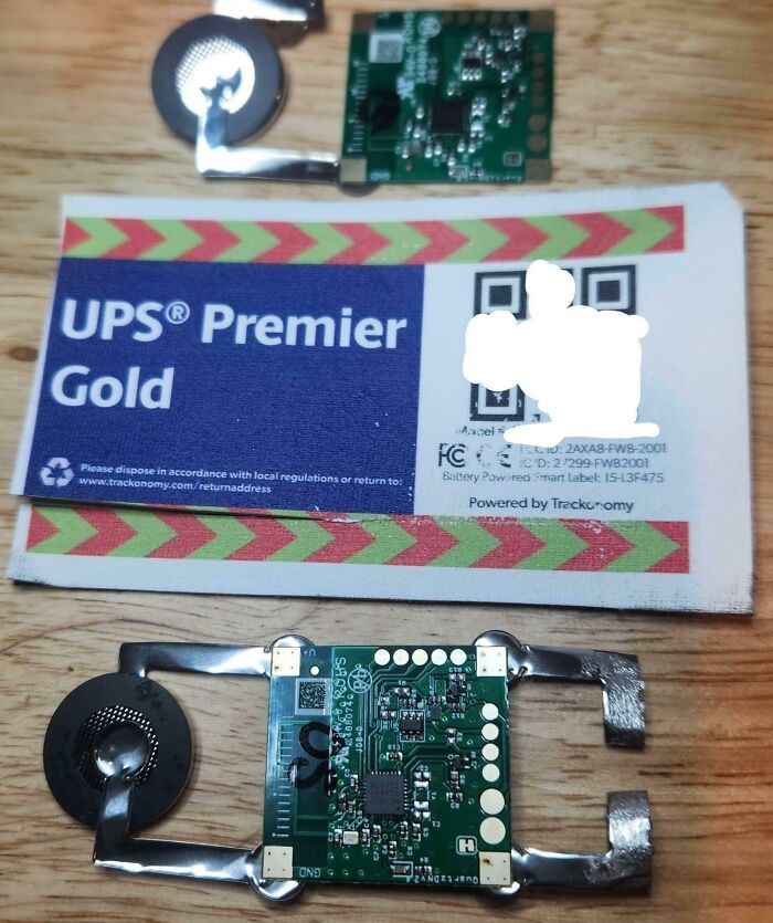 Close-up of electronic circuit boards and components on a wooden surface related to medical technology photos.