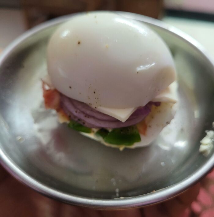 Creative food presentation showing hilarious dads’ unique attempt at nailing fatherhood with an egg sandwich style burger.