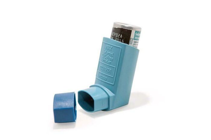 Blue asthma inhaler with cap removed, isolated on white background, illustrating entitled parents' health concerns meme.