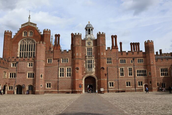 Historic brick building with clock tower and turrets, representing one of the historic buildings nearly lost but saved.