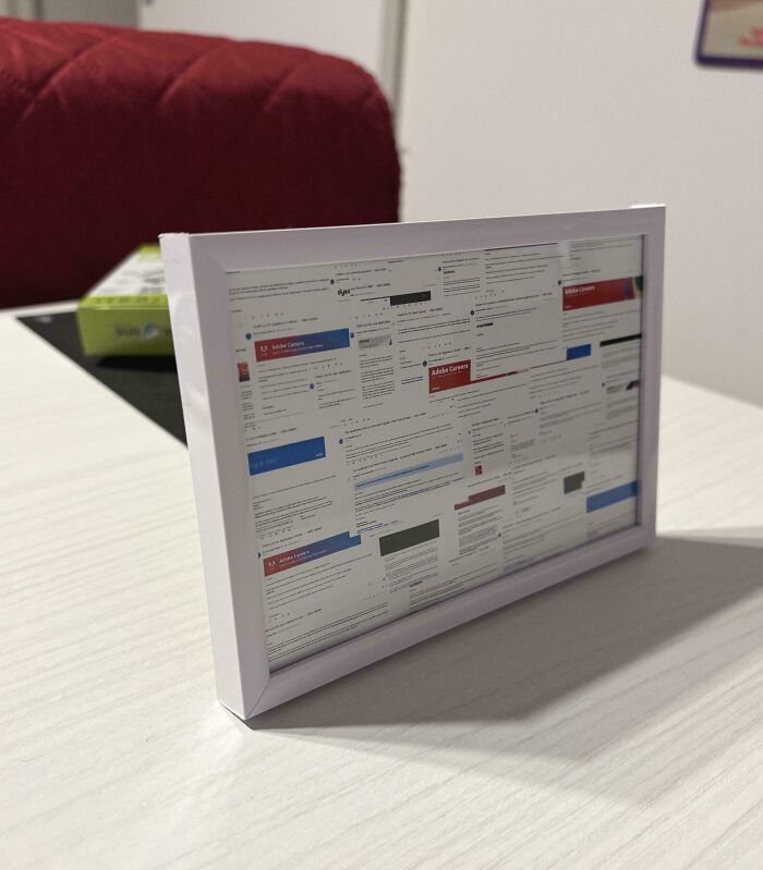 Framed collage of brutal rejection emails displayed on a table highlighting shocking rejection moments.