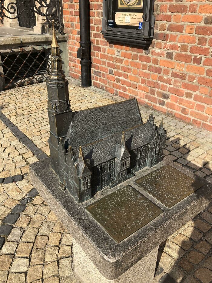 Miniature bronze model of historic building with Braille plaques, showcasing small but genius things some countries do for accessibility.