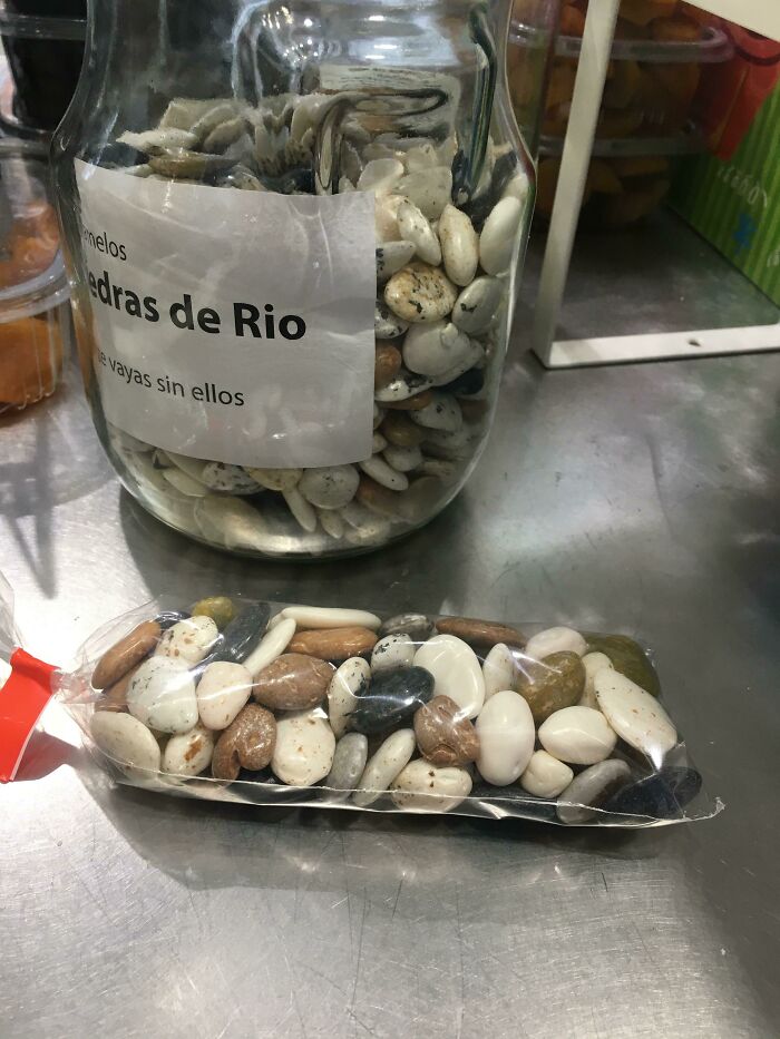 Small but genius packaging of assorted edible seeds in a clear plastic pouch on a metal surface in some countries