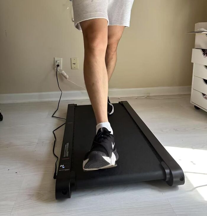 Person walking on a compact treadmill, one of the most wished for items burning up Amazon this week.