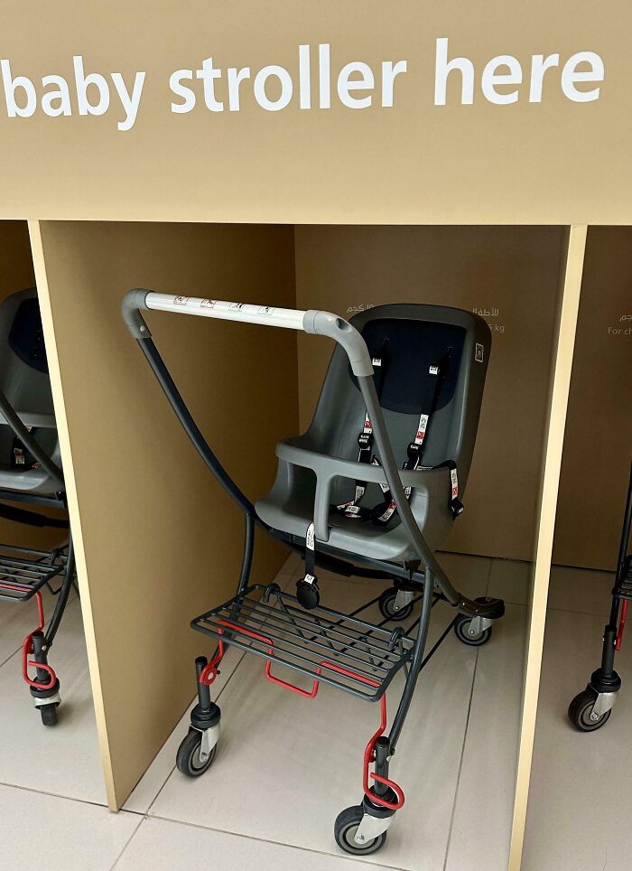 Baby stroller with safety harness in a designated area, showcasing small genius things some countries do for convenience.