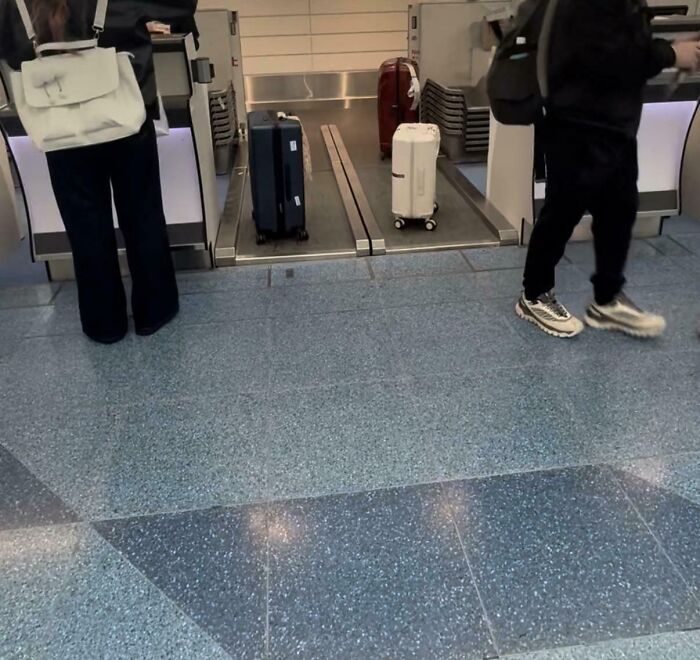 Automated suitcase conveyor belt at airport check-in counter showing small but genius travel innovation in some countries.