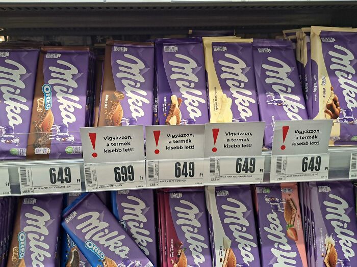 Rows of Milka chocolate bars with price tags, showcasing small but genius packaging changes in some countries.