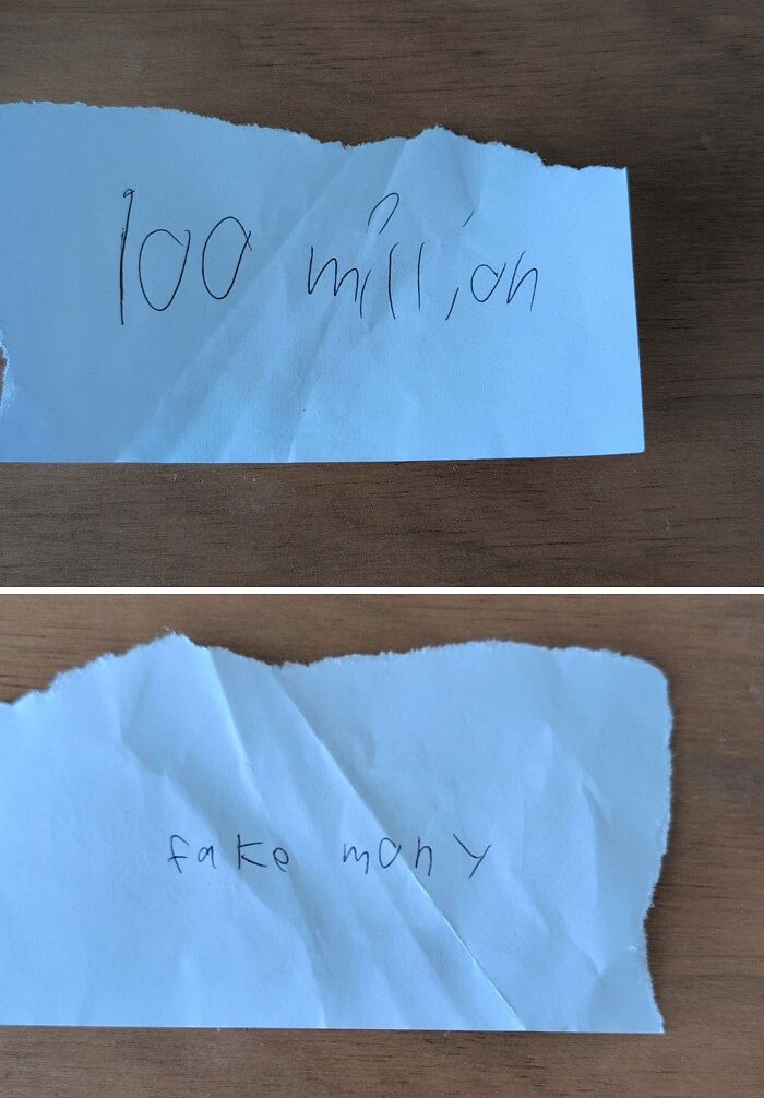Torn pieces of paper with childlike handwriting saying 100 million and fake money, showcasing wholesome and funny dads.