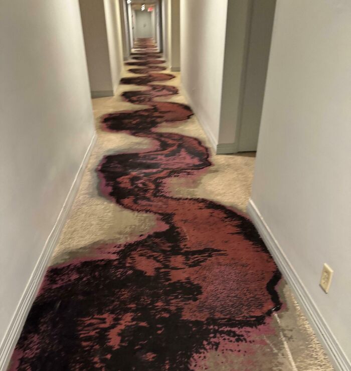 Hotel hallway carpet design creating a confusing and messy appearance, showcasing one of the hotels messed up online.