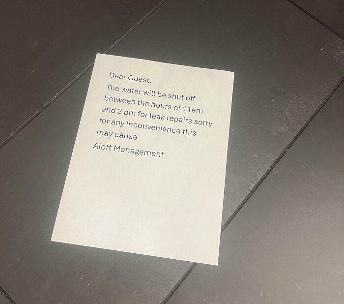 Notice on floor from hotel management about water shut off for leak repairs, a common hotel mess-up shared online.