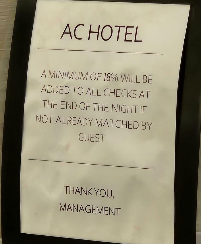 Sign at a hotel stating an 18% charge will be added to checks if not matched by guest, showing hotel mess up.