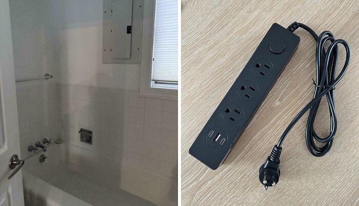Bathroom missing safety features beside electrical panel and black power strip with outlets and USB ports on wooden floor
