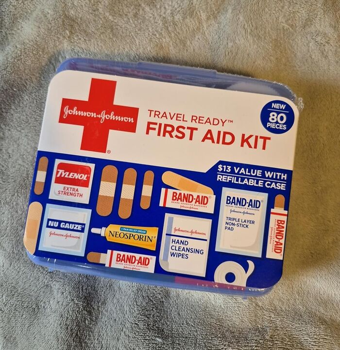 Johnson & Johnson travel ready first aid kit with 80 pieces, including band-aids, Neosporin, and cleansing wipes for safety fixes.