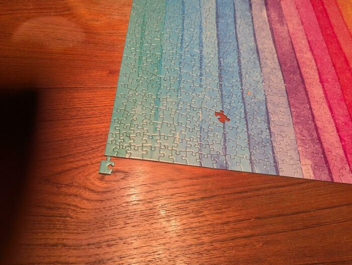 Incomplete jigsaw puzzle with a missing and misplaced piece highlighting imperfect things that annoy people with OCD.
