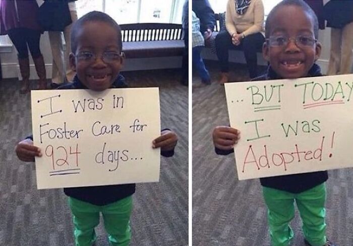 Smiling boy holding signs about foster care and adoption, an extraordinary and fascinating moment captured.