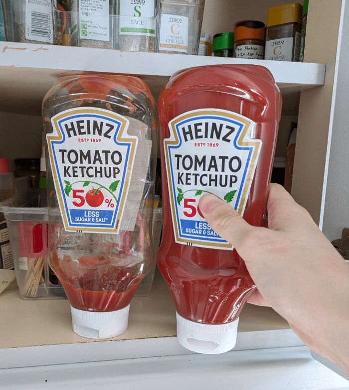Two Heinz ketchup bottles in a pantry, one nearly empty and the other full, highlighting imperfect things that annoy.