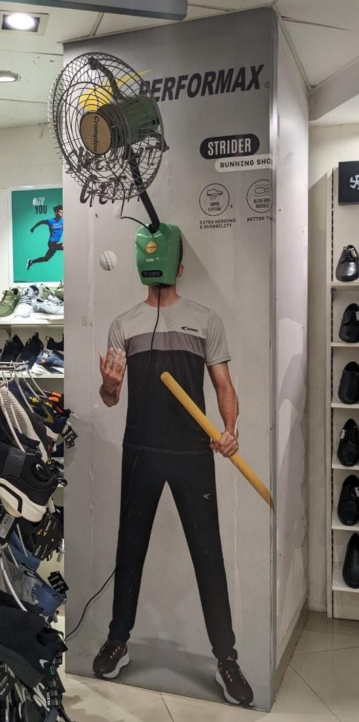 Advertising fail with a sportswear mannequin and a wall fan creatively misaligned in a retail store setting.