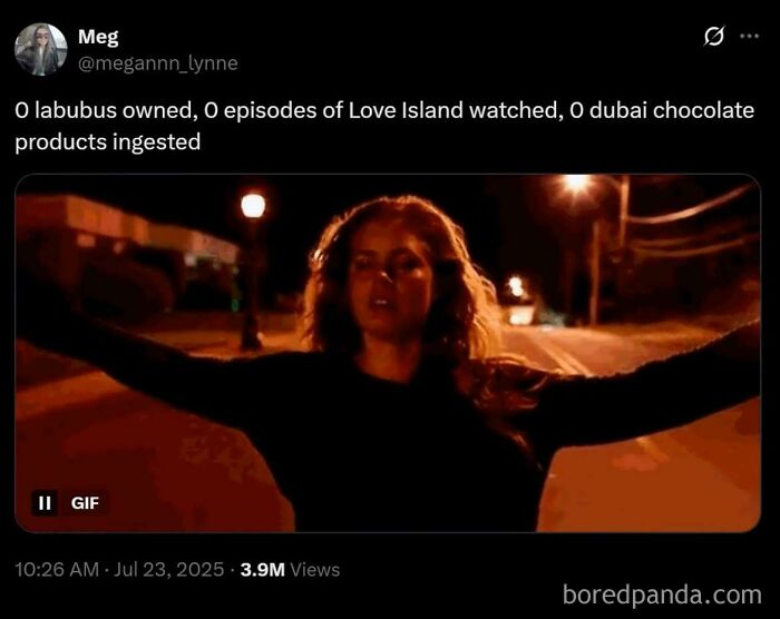 A woman standing on a dimly lit street at night, symbolizing resistance to consumerism and excessive consumption.