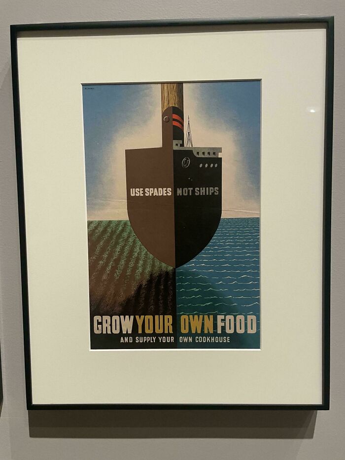 Framed vintage poster showing a shovel shaped like a ship promoting growing your own food and smart design.