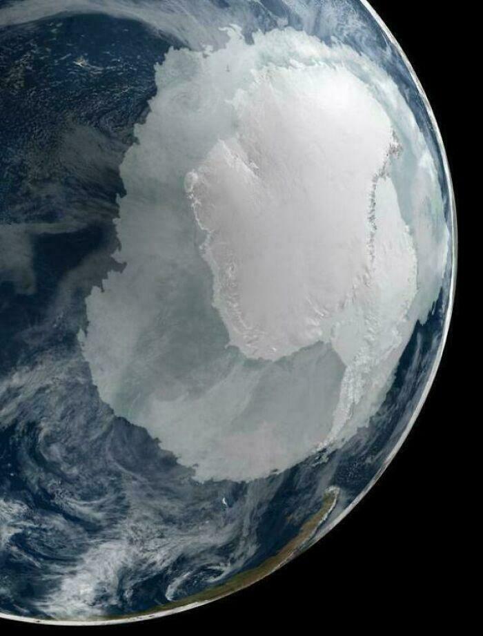 Satellite view of Antarctica, an extremely large continent, highlighting its scary and eerie vastness.