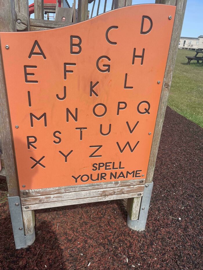 Playground alphabet board with missing letters and spelling error showcasing a hilarious preventable fail.