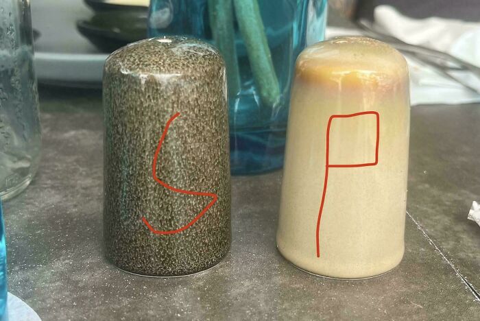 Salt and pepper shakers with labels painted on the wrong containers, a classic preventable fail humor photo.