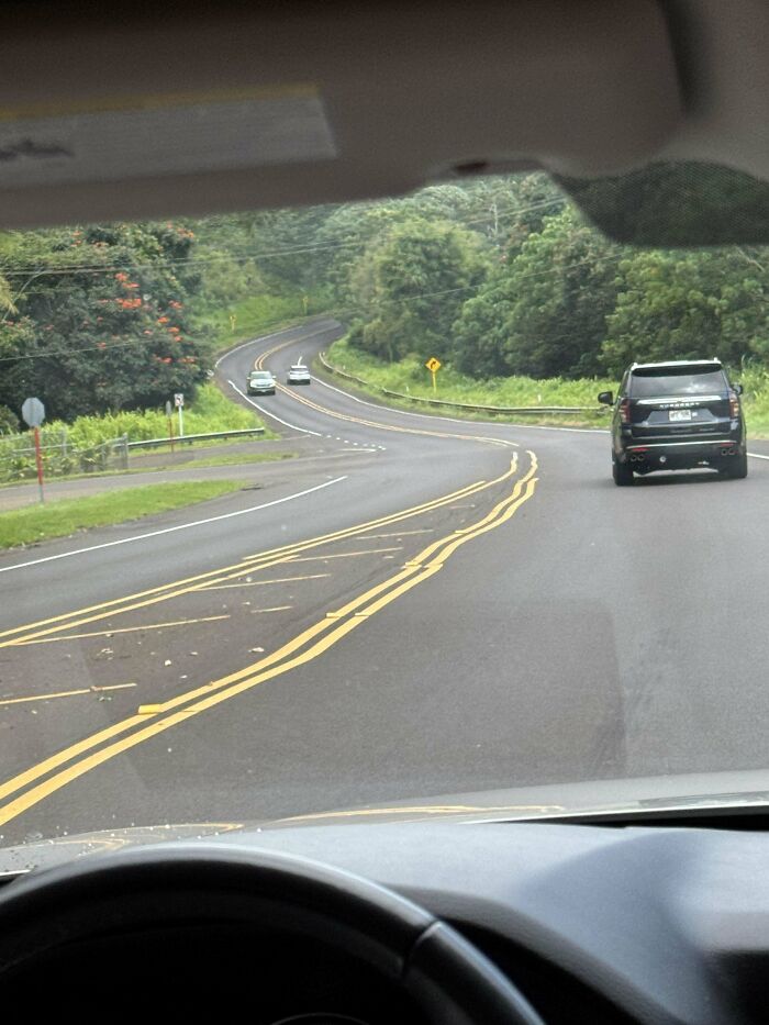 View from a car showing a road with multiple overlapping yellow lines, a perfectly preventable fail on road marking.
