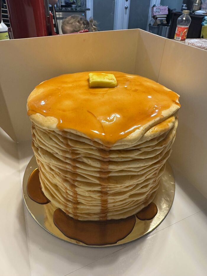 Stack of pancakes with syrup and a pat of butter, a creative bake among incredible bakes deserving the spotlight.